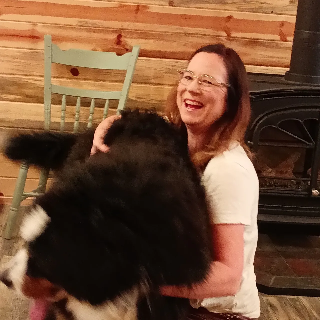 A woman holding onto a large stuffed animal