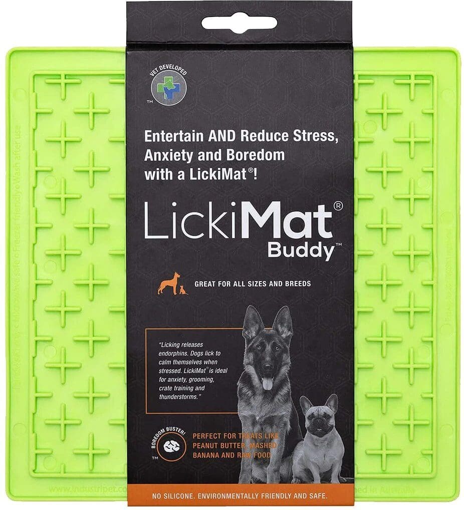 A lime green lick mat with a dog on it