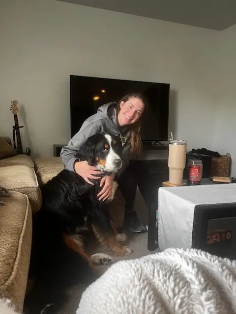 A woman and her dog in the living room